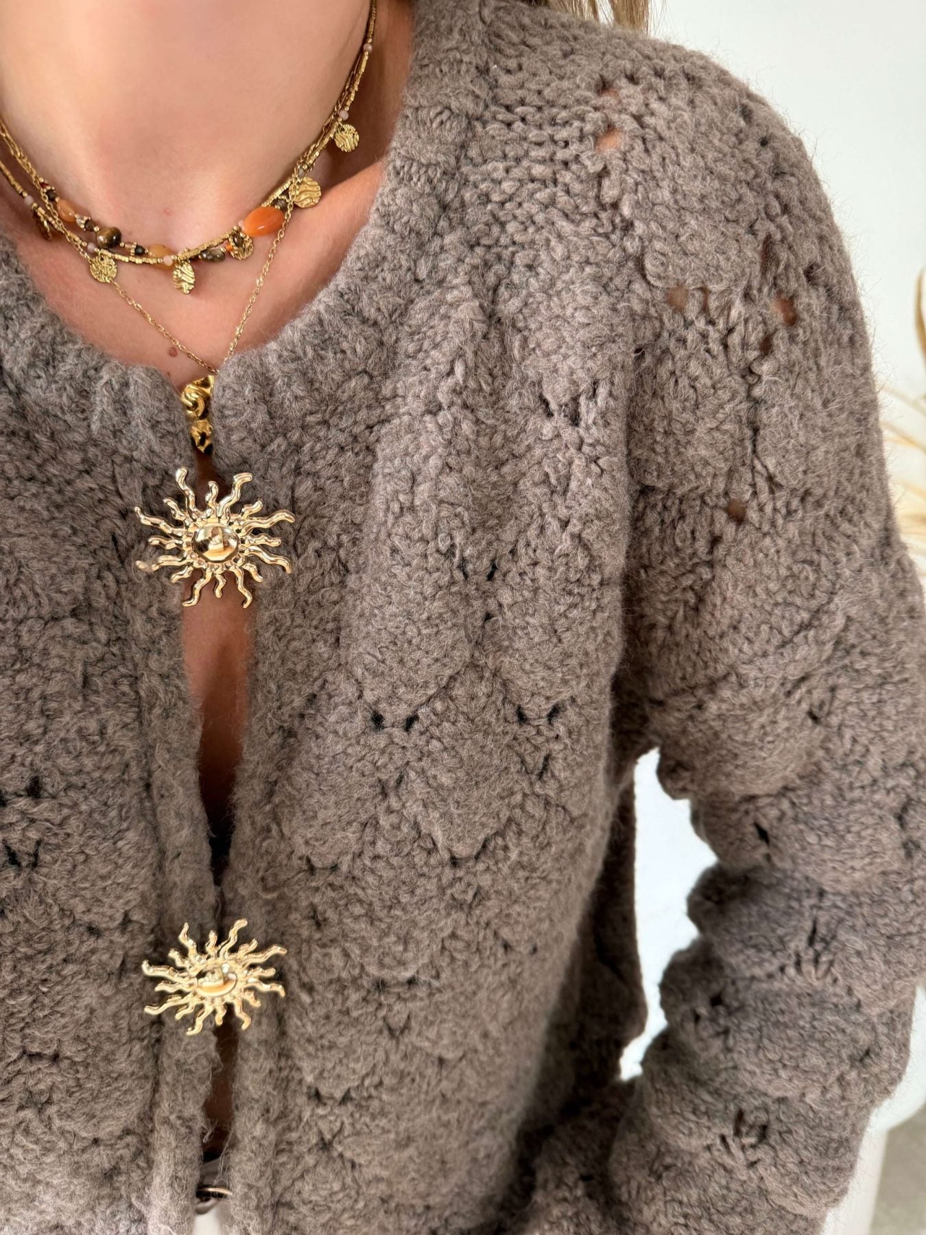 Cardigan broches soleil