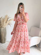 Robe longue fleurie rose Lyséa avec dos ouvert, manches fluides et coupe bohème chic du S au 4XL.