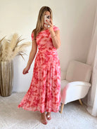 Robe longue rose imprimée asymétrique Valencia avec jupe fluide plissée