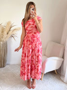 Robe longue rose imprimée asymétrique Valencia avec jupe fluide plissée