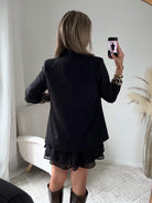 veste Léo noire : une veste fluide et doublée, manches longues, idéale pour la mi-saison